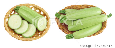 zucchini or marrow in a wicker basket isolated on white background with full depth of field. Top view. Flat lay 137830747