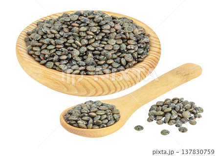 raw french green lentils in wooden bowl and spoon isolated on white background with full depth of field raw french green lentils in wooden bowl and spoon isolated on white background with full depth of field 137830759