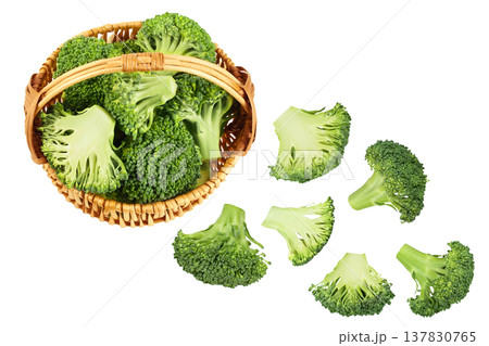 fresh broccoli in wicker basket isolated on white background close-up with full depth of field. Top view. Flat lay fresh broccoli in wicker basket isolated on white background close-up with full depth of field. Top view. Flat lay 137830765