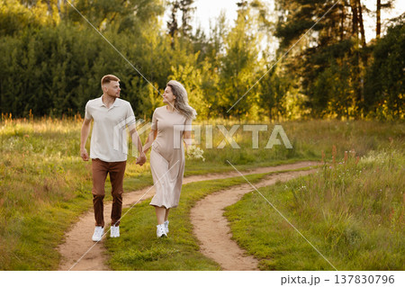 Serene Family Walk Amidst Tall Grasses And Distant Trees Capturing Heartfelt Moments Serene Family Walk Amidst Tall Grasses And Distant Trees Capturing Heartfelt Moments 137830796