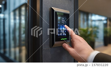 Businessperson entering security code on access control keypad Businessperson entering security code on access control keypad 137831220