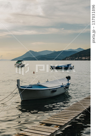 Beautiful boat in the sea near Dubrovnik city on a sunset. 137831896