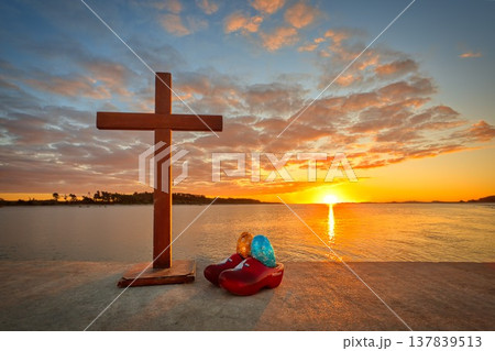 Sunset Cross With Dutch Clogs and Easter Eggs 137839513