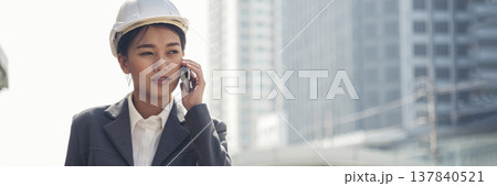 Banner Woman engineer entrepreneur construction industry worker. Banner Female engineer working refinery oil plant manufacturing. Civil engineering construction hard hat safety helmet with copy space 137840521