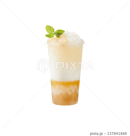 Green Lemon Tea. Zesty green lemon tea with many citrus slices and ice, isolated on white. 137841889