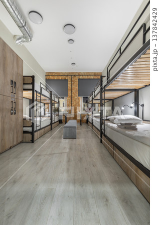 Symmetrical Modern Hostel Dormitory with Bunk Beds and Lockers Symmetrical Modern Hostel Dormitory with Bunk Beds and Lockers 137842429