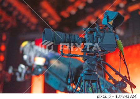 Professional Broadcast TV Camera on Tripod at Live Concert with copy space 137842824