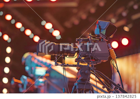 Professional Broadcast TV Camera on Tripod at Live Concert with copy space 137842825