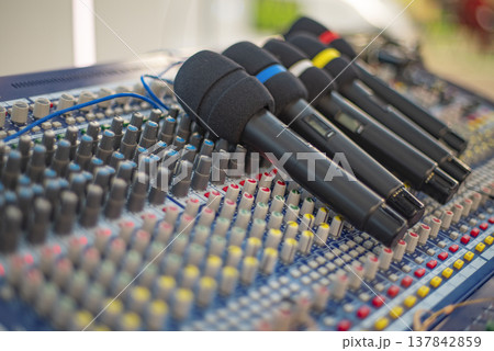 Professional Wireless Microphones on Mixing Console Ready for Event with copy space Professional Wireless Microphones on Mixing Console Ready for Event with copy space 137842859