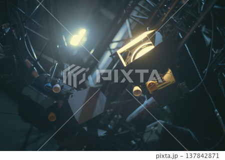 Professional Studio Spotlights Glowing in Dark Backstage with copy space Professional Studio Spotlights Glowing in Dark Backstage with copy space 137842871