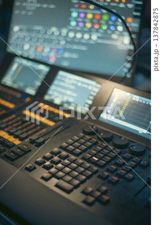 Professional Lighting Control Console with Touch Screens in Dark Studio with copy space Professional Lighting Control Console with Touch Screens in Dark Studio with copy space 137842875