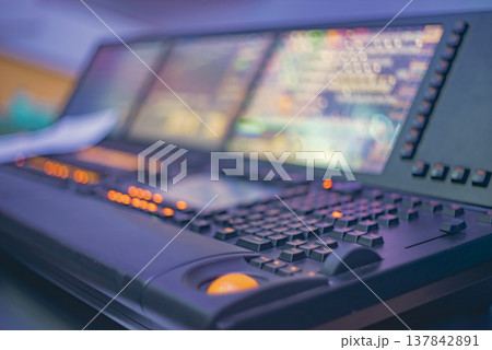 High-tech stage lighting control system with glowing buttons and monitors with copy space High-tech stage lighting control system with glowing buttons and monitors with copy space 137842891