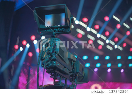 Professional TV camera with monitor on stage background with copy space 137842894