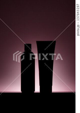 Silhouetted shampoo bottle and conditioner tube set Silhouetted shampoo bottle and conditioner tube set 137843197