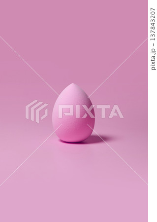 Pink makeup sponge on pastel pink background Pink makeup sponge on pastel pink background 137843207