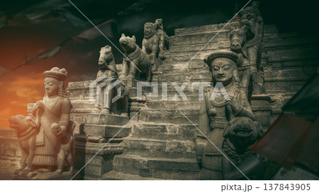 Ancient stone statues of Nyatapola temple in Bhaktapur Nepal at sunset with copy space Ancient stone statues of Nyatapola temple in Bhaktapur Nepal at sunset with copy space 137843905