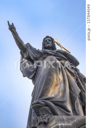 statues on the Charles Bridge, evening of the city of Prague. 137844049
