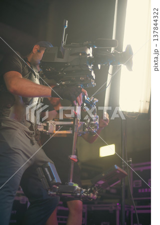 Professional Steadicam Operator Working with Camera in Studio 137844322