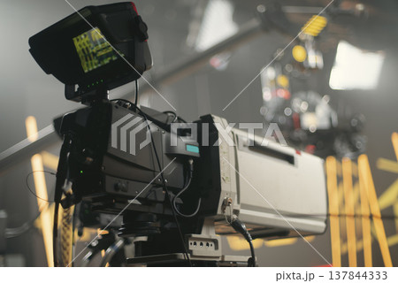 Professional broadcasting camera in modern TV studio with equipment and copy space Professional broadcasting camera in modern TV studio with equipment and copy space 137844333