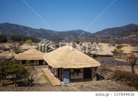 Traditional Korean village with thatched houses and jars 137844616