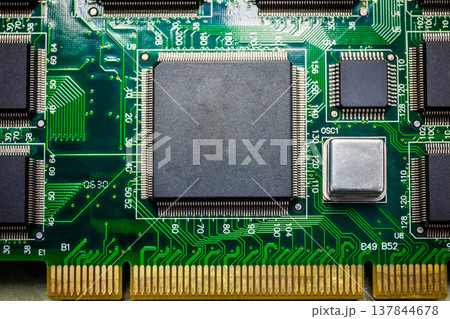 Closeup of Chips on boards of computer and smart devices Processing with a slot to connect to the motherboard. Select focus and Copy space background Closeup of Chips on boards of computer and smart devices Processing with a slot to connect to the motherboard. Select focus and Copy space background 137844678