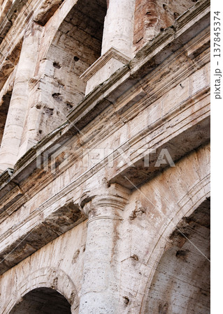 Exploring the ancient architecture of the Roman Colosseum in Italy during afternoon sunlight Exploring the ancient architecture of the Roman Colosseum in Italy during afternoon sunlight 137845374
