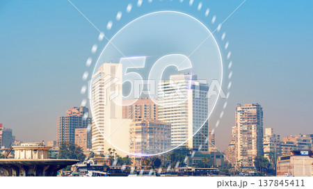 5G internet logo over city skyline with buildings and clear sky during daytime 137845411