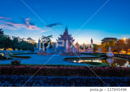 Beautiful and amazing white art temple in sunset time at Wat Rong Khun Chiang Rai, Thailand It is a tourist destination. Landmark of Chiang Rai 137845496