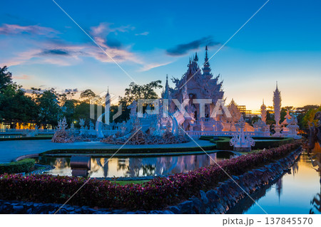 Beautiful and amazing white art temple in sunset time at Wat Rong Khun Chiang Rai, Thailand It is a tourist destination. Landmark of Chiang Rai 137845570