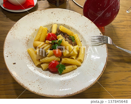 Rotini pasta with meat, mushrooms and tomatoes Rotini pasta with meat, mushrooms and tomatoes 137845648