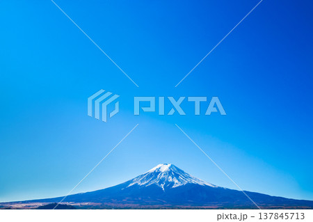 Mt. Fuji on a clear day with blue sky It is a symbol of Yamanashi City, Lake Kawaguchiko, Japan. Copy space background Mt. Fuji on a clear day with blue sky It is a symbol of Yamanashi City, Lake Kawaguchiko, Japan. Copy space background 137845713
