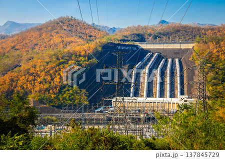Srinakarin Dam the power station with large mountains and many trees at Kanchanaburi, Thailand. To generate electricity in the western region of the country Srinakarin Dam the power station with large mountains and many trees at Kanchanaburi, Thailand. To generate electricity in the western region of the country 137845729