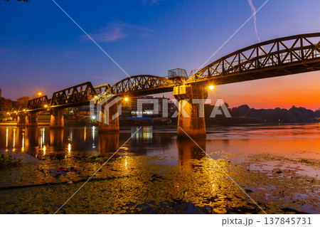 Beautiful Landscape of Bridge River Kwai at Kanchanaburi, Thailand in sunrise time. Is a famous place and a tourist destination 137845731