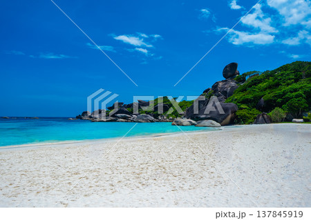 Beautiful view with blue sky and clouds, blue sea and white sand beach on Similan island, No.8 at Similan national park, Phuket, Thailand is most popular vacation for tourist. 137845919
