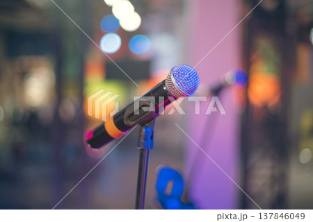 Professional Wireless Vocal Microphone on Stage with Neon Bokeh and Copy Space Professional Wireless Vocal Microphone on Stage with Neon Bokeh and Copy Space 137846049
