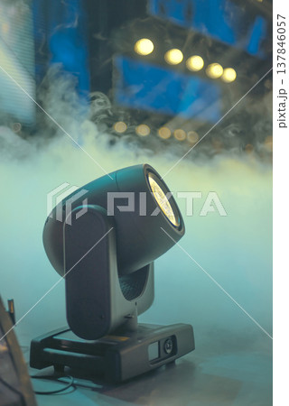 Professional Moving Head Stage Light in Fog on Concert Backdrop with Copy Space Professional Moving Head Stage Light in Fog on Concert Backdrop with Copy Space 137846057