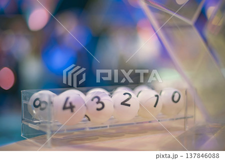 White Lottery Balls with Numbers in Transparent Tray with Copy Space 137846088