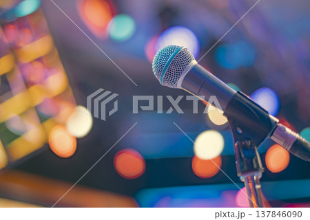 Professional Vocal Microphone on Stage with Colorful Bokeh and Copy Space 137846090