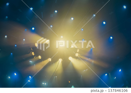Abstract Stage Light Explosion with Yellow Beams and Teal Spotlights with copy space 137846106