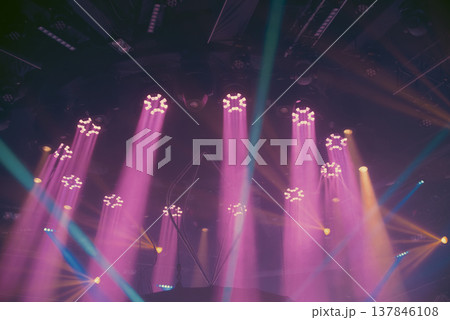 Professional Stage Lighting with Purple Beams and Teal Spotlights with copy space Professional Stage Lighting with Purple Beams and Teal Spotlights with copy space 137846108