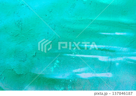 Teal Graffiti Wall Texture with Spray Paint Drips and Grungy Concrete 137846187