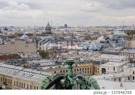 St. Petersburg showcases a breathtaking skyline filled with various rooftops and domes, including prominent structures beneath a dramatic sky. 137846788