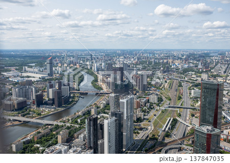 A stunning view of Moscow showcasing the river winding through the city, surrounded by contemporary architecture and lush greenery under a bright blue sky. A stunning view of Moscow showcasing the river winding through the city, surrounded by contemporary architecture and lush greenery under a bright blue sky. 137847035