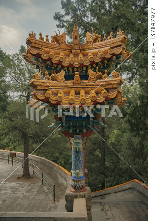 Ornate Chinese Pillar with Yellow Tile Roof in Beijing Beihai Park with copy space Ornate Chinese Pillar with Yellow Tile Roof in Beijing Beihai Park with copy space 137847977