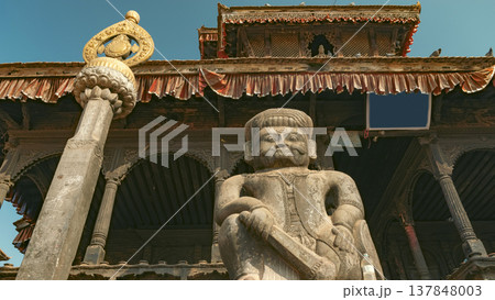 Ancient Stone Warrior Guardian Statue at Dattatreya Temple Nepal with Copy Space Ancient Stone Warrior Guardian Statue at Dattatreya Temple Nepal with Copy Space 137848003