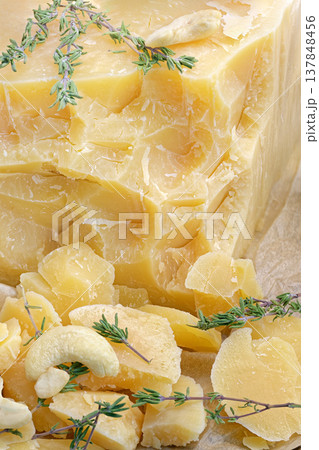 Large block of aged hard cheese 137848456