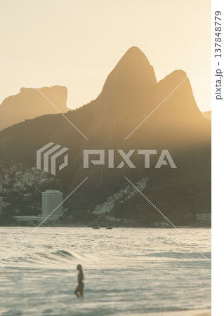 Beautiful Sunset over Ipanema Beach in Rio de Janeiro with  Mountains and Copy Space 137848779