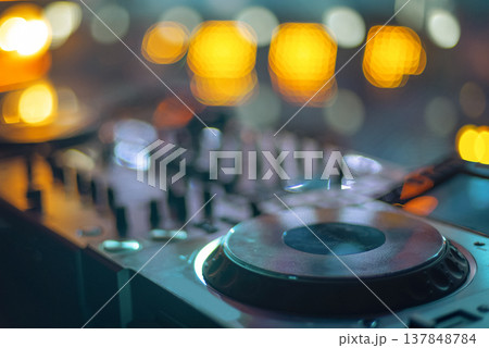 Professional DJ Deck Close-up with Blue Neon Glow and Ample Copy Space on Blurred Background 137848784