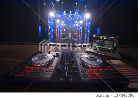 Professional DJ Setup on Empty Concert Stage Before Performance 137848796