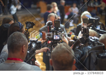 Crowded Press Conference with Video Cameras and Microphones for Breaking News Concept Crowded Press Conference with Video Cameras and Microphones for Breaking News Concept 137848810